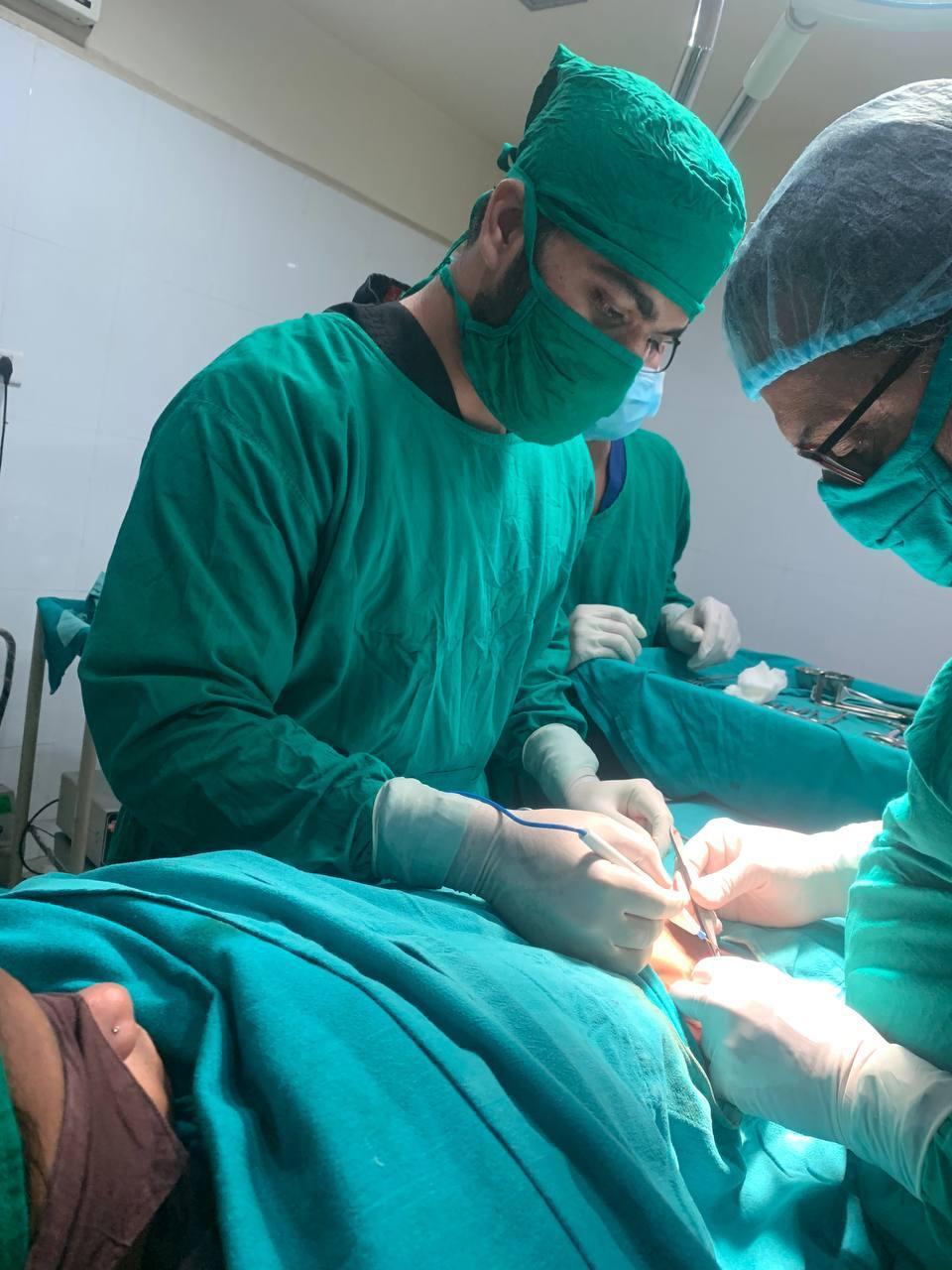 Dr. G. Vijay Kumar performing surgery at Pulse Health Clinic